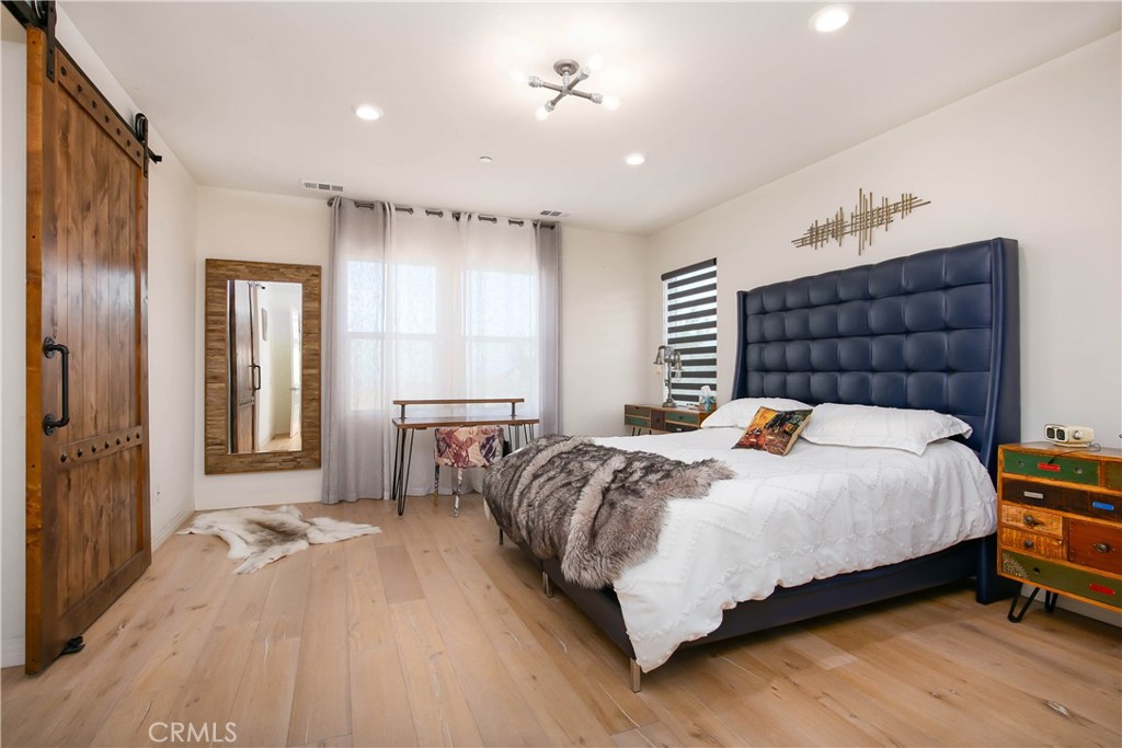 19680 Griffith Drive Saugus, CA 91350 - Photo 29 of 49 a bed sitting in a spacious bedroom next to a window