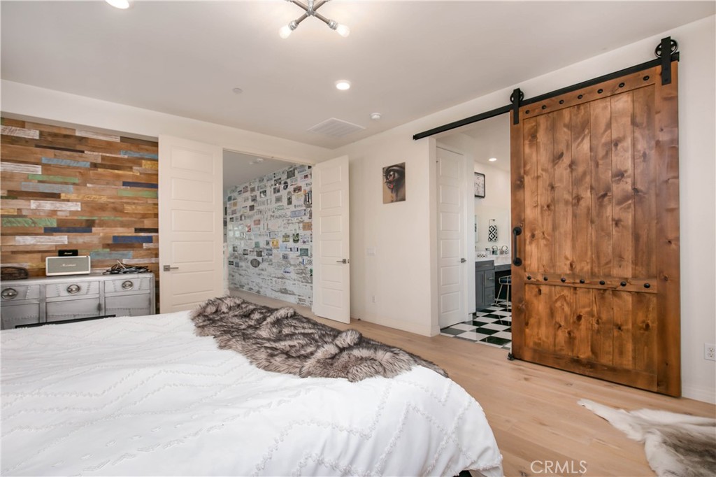 19680 Griffith Drive Saugus, CA 91350 - Photo 30 of 49 a bedroom with a large bed and a window