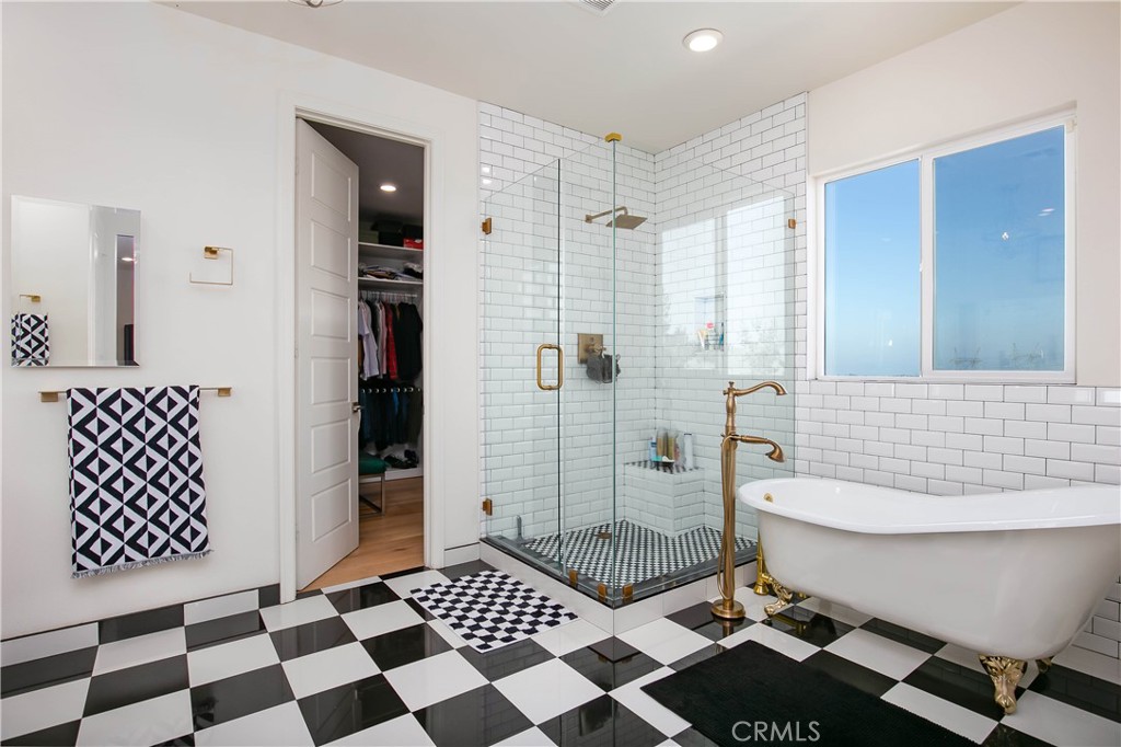 19680 Griffith Drive Saugus, CA 91350 - Photo 31 of 49 a bathroom with a black white checkered floor