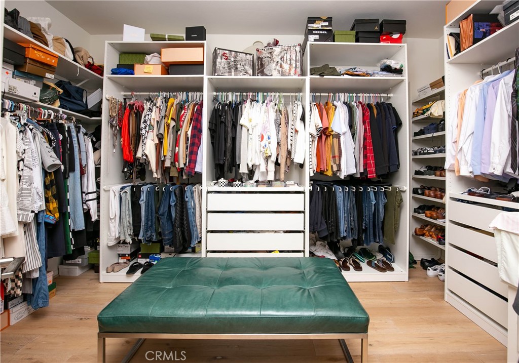 19680 Griffith Drive Saugus, CA 91350 - Photo 32 of 49 a view of walk in closet with clothes and shoes