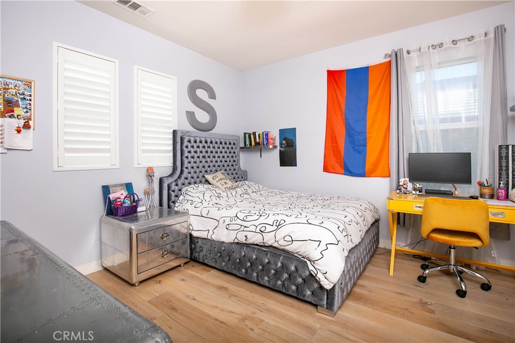 19680 Griffith Drive Saugus, CA 91350 - Photo 35 of 49 a bedroom with a bed a dresser and a window