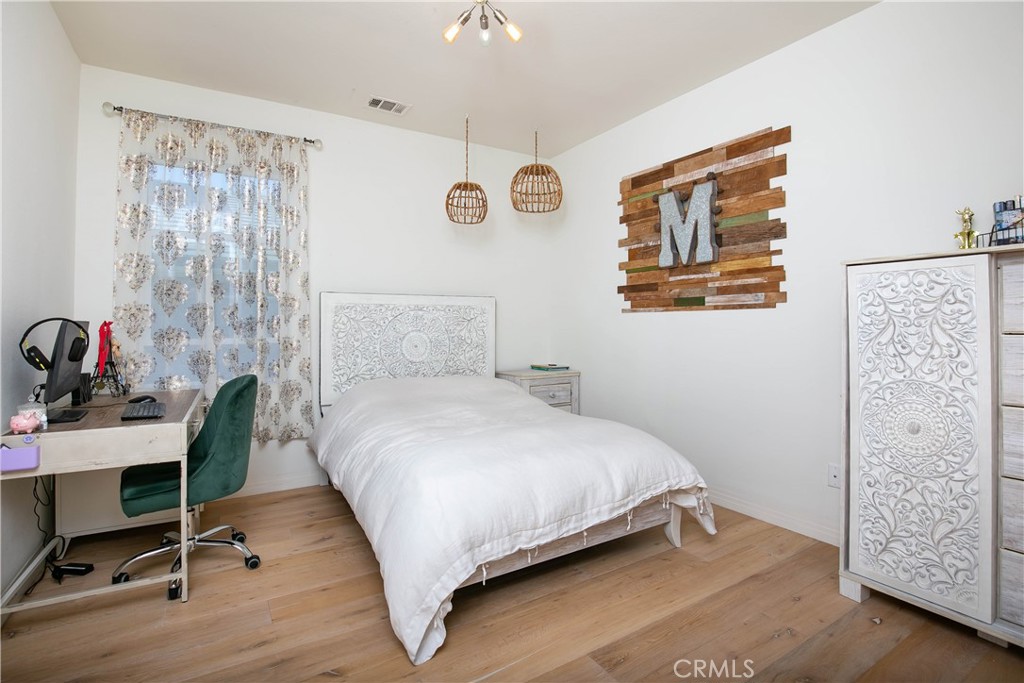 19680 Griffith Drive Saugus, CA 91350 - Photo 36 of 49 a bedroom with a bed and a desk