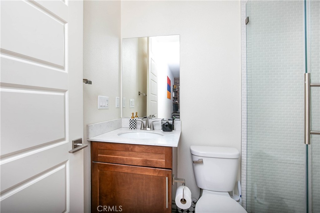 19680 Griffith Drive Saugus, CA 91350 - Photo 37 of 49 a bathroom with a sink toilet vanity and mirror