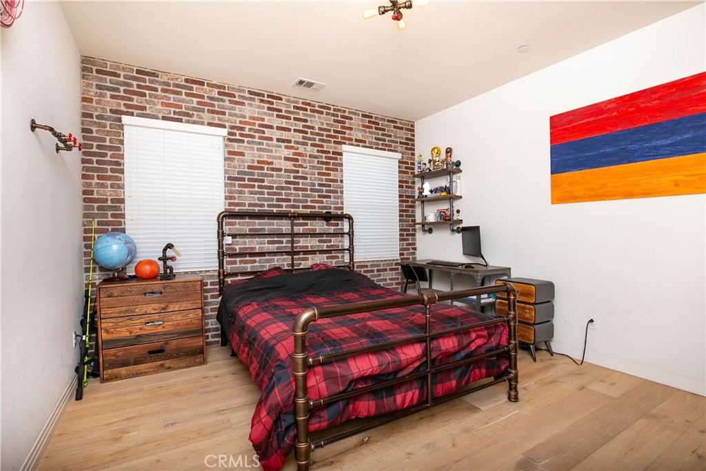 19680 Griffith Drive Saugus, CA 91350 - Photo 38 of 49 a bedroom with a bed and a window