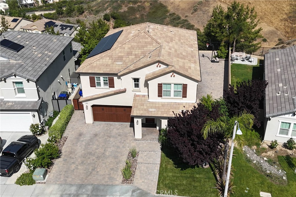 19680 Griffith Drive Saugus, CA 91350 - Photo 45 of 49 a front view of a house with a yard and garage