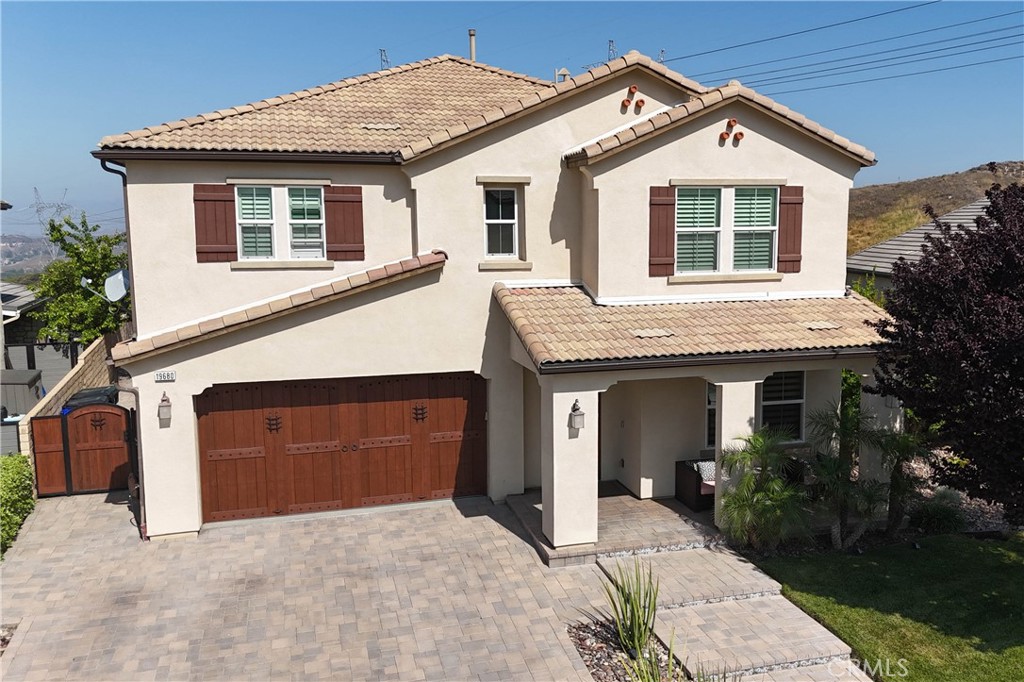 19680 Griffith Drive Saugus, CA 91350 - Photo 48 of 49 a front view of a house with a garden and trees