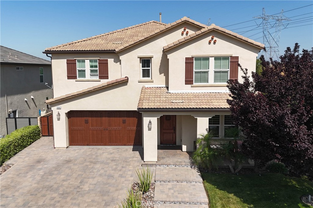 19680 Griffith Drive Saugus, CA 91350 - Photo 49 of 49 a front view of a house with a yard and garage