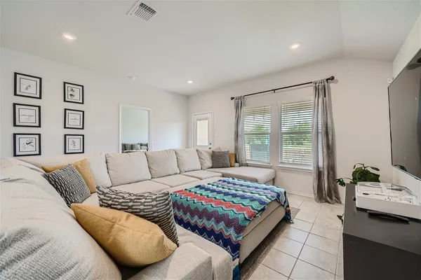 a bedroom with a bed and a couch