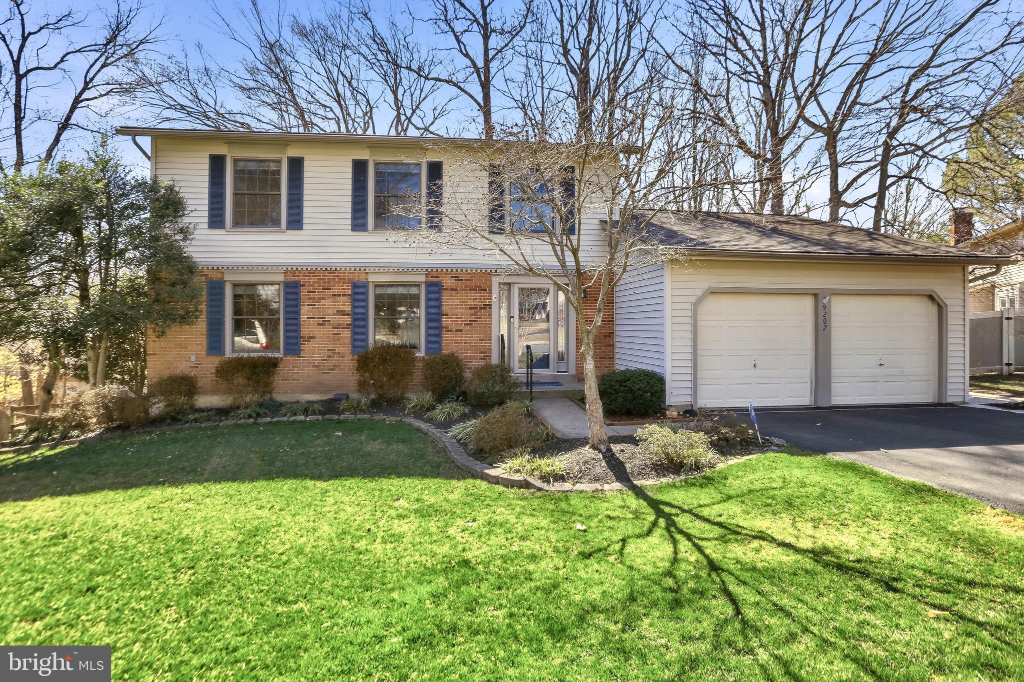 9202 Rockefeller Lane Springfield, VA 22153 - Photo 1 of 38 a front view of house with yard and green space