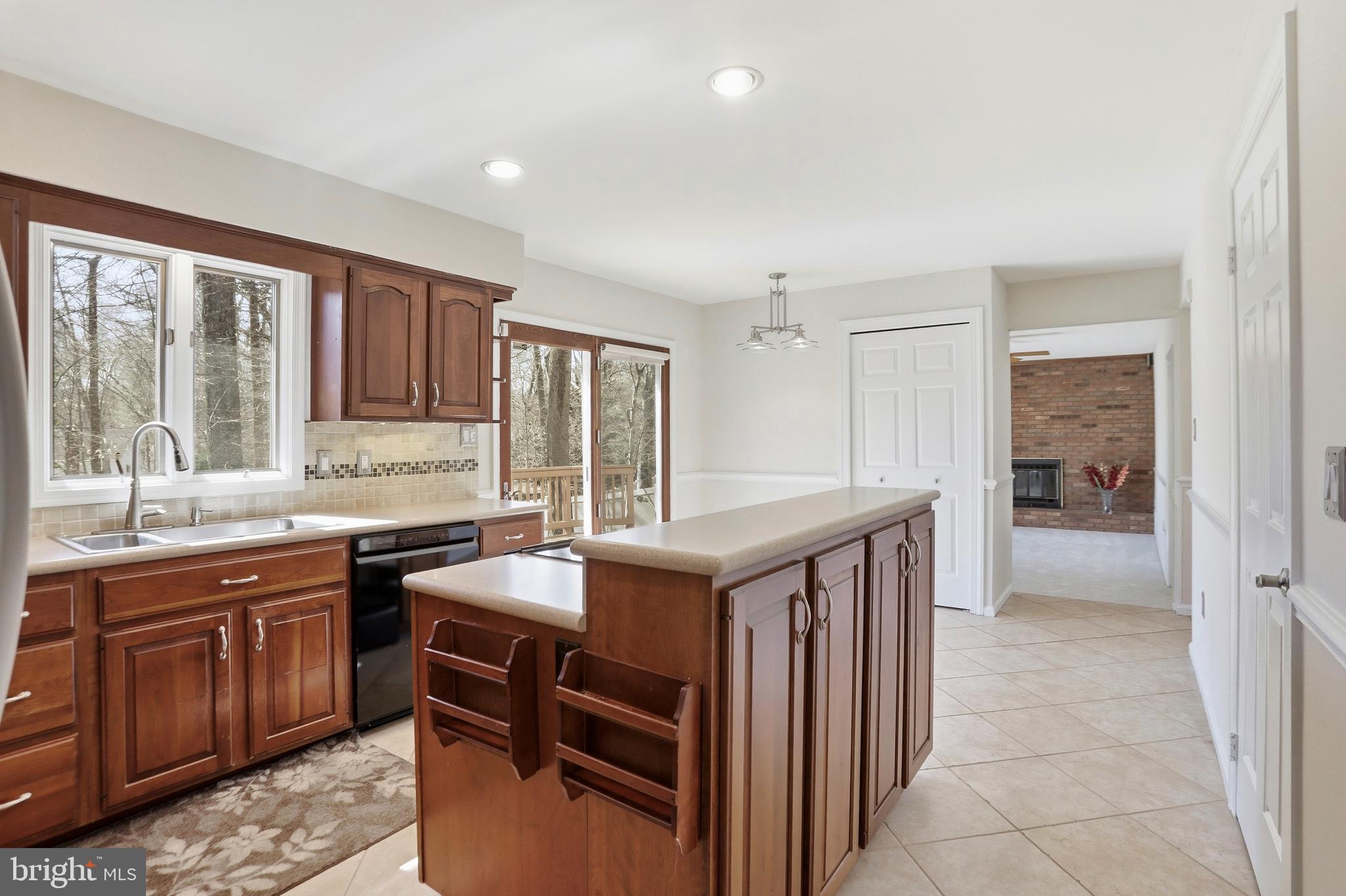 9202 Rockefeller Lane Springfield, VA 22153 - Photo 14 of 38 a kitchen that has a sink and a stove in it
