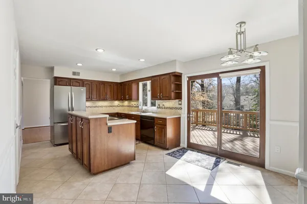 a kitchen with stainless steel appliances granite countertop a stove top oven and sink