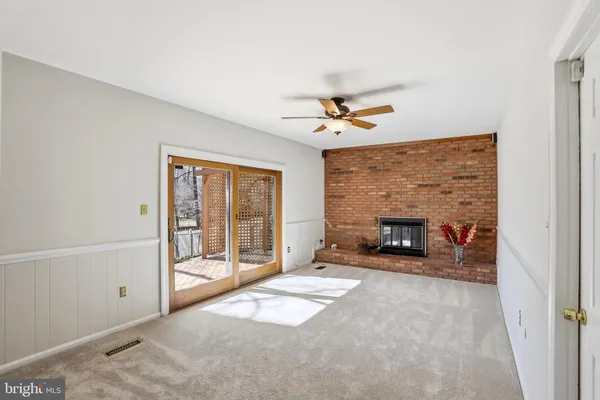 a view of an empty room with a fireplace