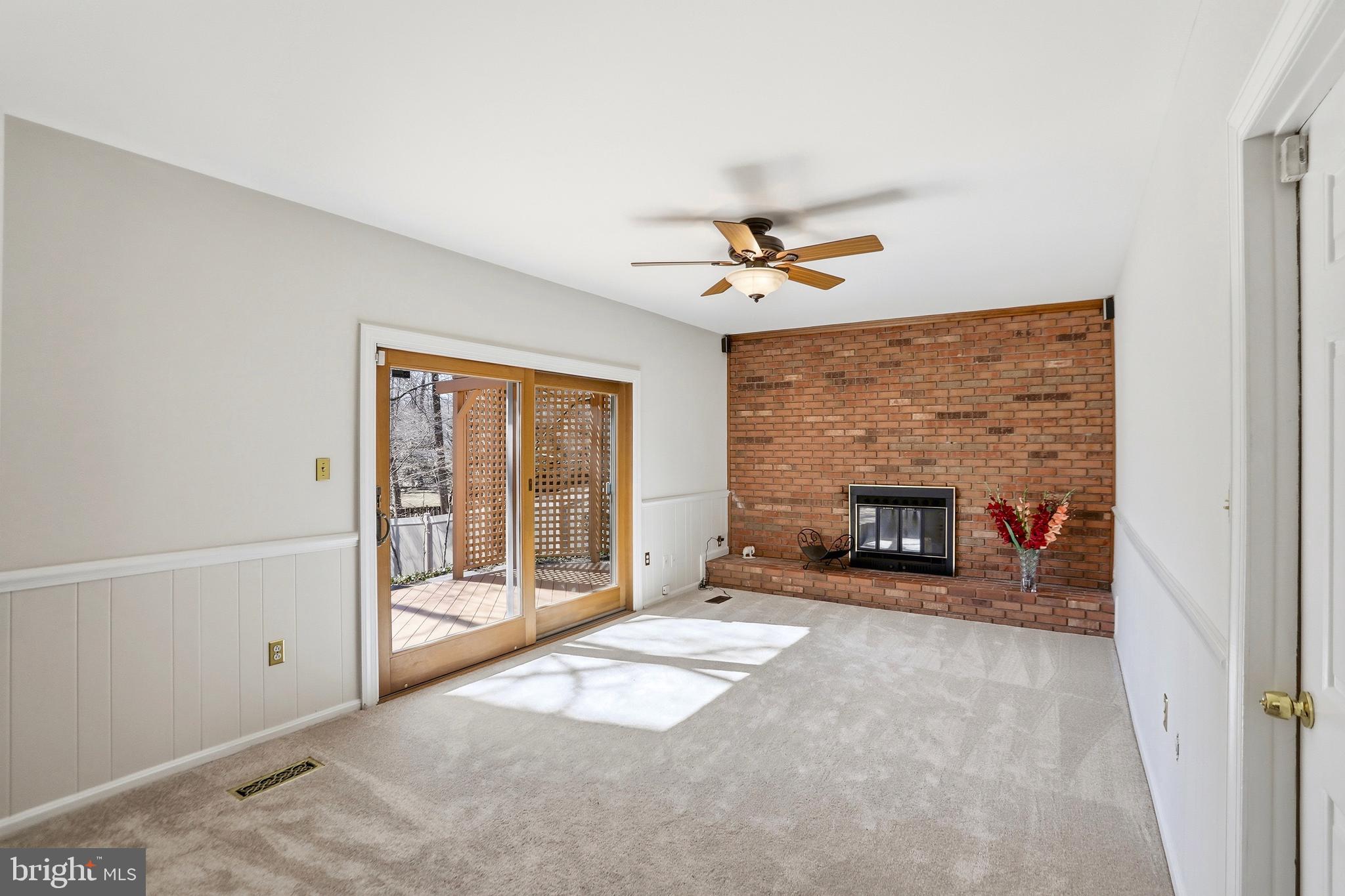 9202 Rockefeller Lane Springfield, VA 22153 - Photo 20 of 38 a view of an empty room with a fireplace