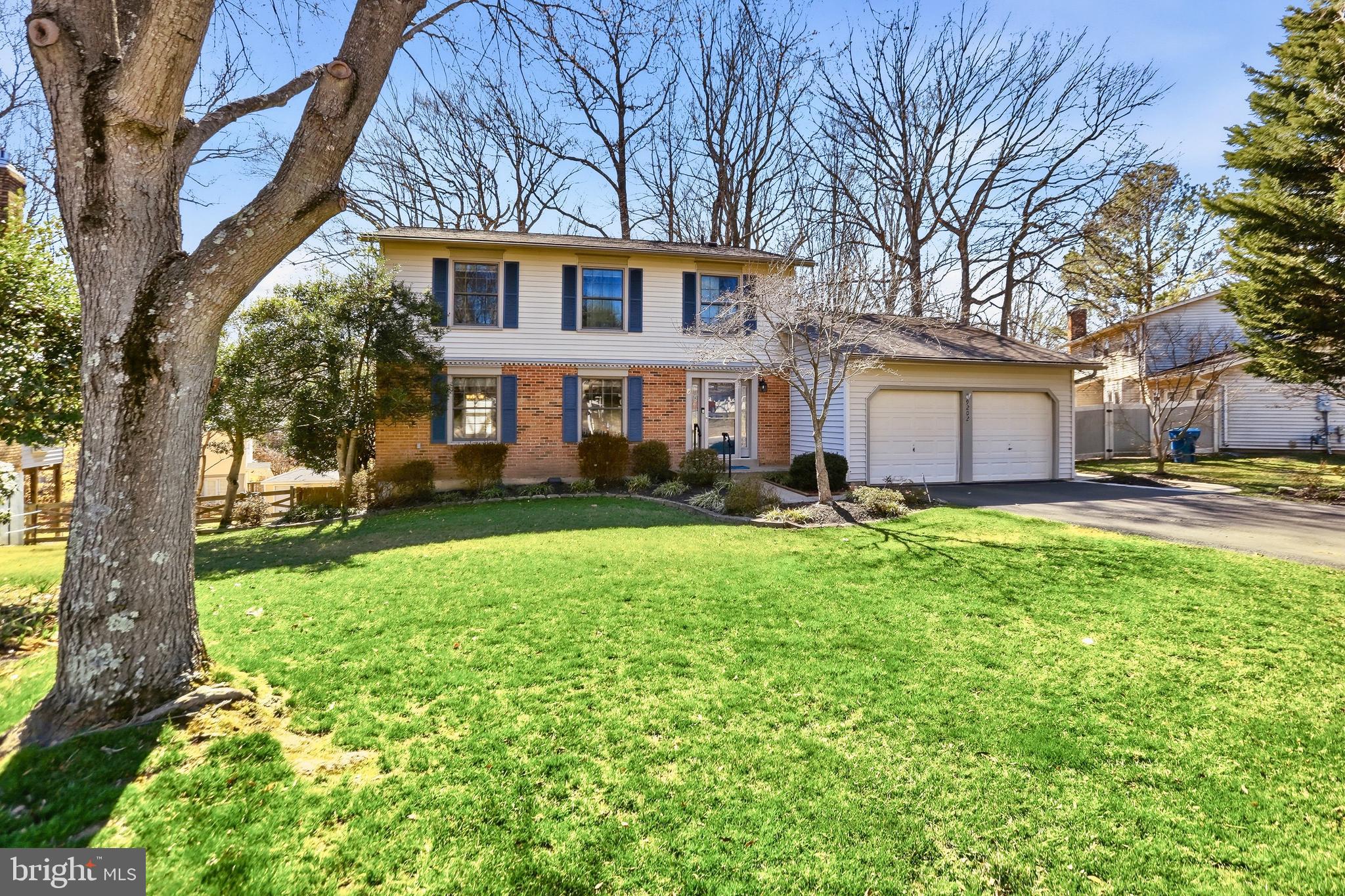 9202 Rockefeller Lane Springfield, VA 22153 - Photo 2 of 38 a front view of a house with garden