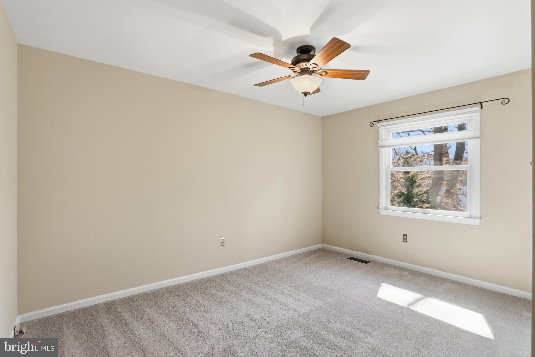 9202 Rockefeller Lane Springfield, VA 22153 - Photo 23 of 38 a view of an empty room with a window