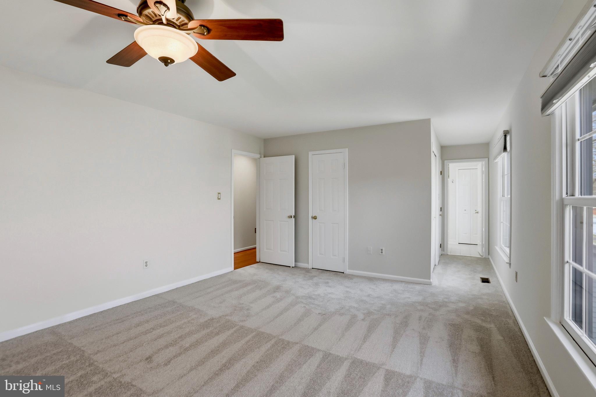 9202 Rockefeller Lane Springfield, VA 22153 - Photo 7 of 38 a view of a room with a ceiling fan and window