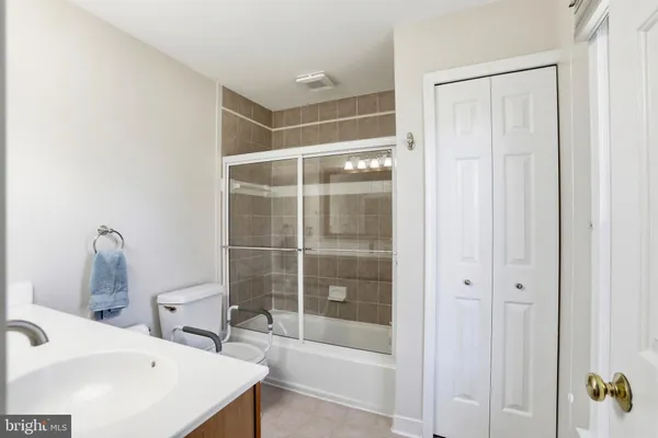 a bathroom with a bathtub and a sink