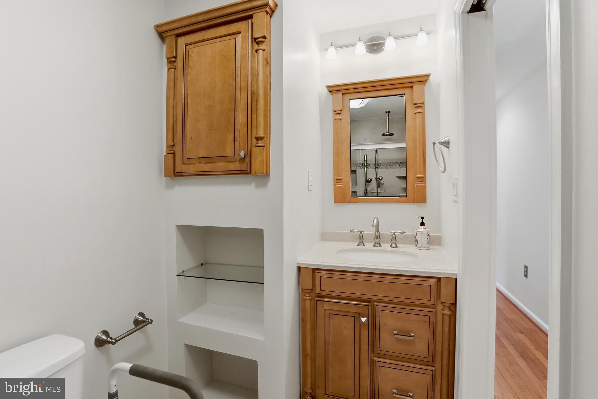 9202 Rockefeller Lane Springfield, VA 22153 - Photo 10 of 38 a bathroom with a sink and a mirror