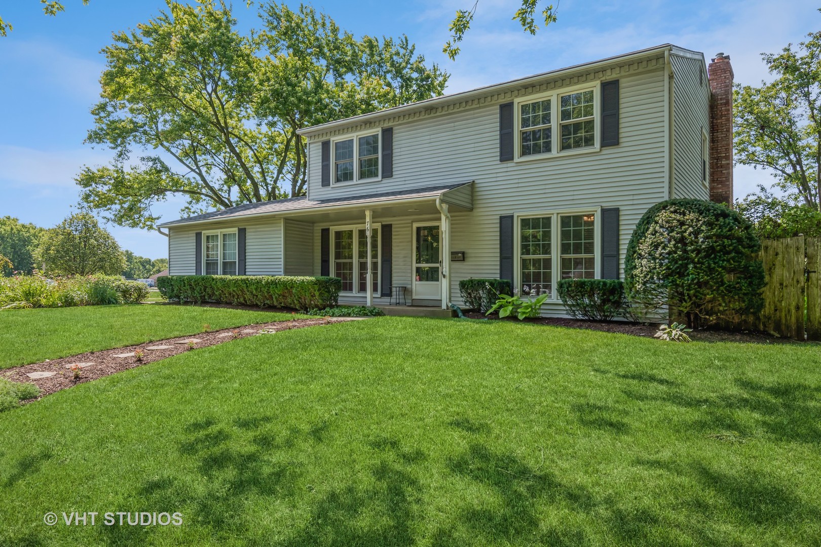 76 West Bailey Road Naperville, IL 60565 - Photo 1 of 20 a view of an house with backyard space and garden