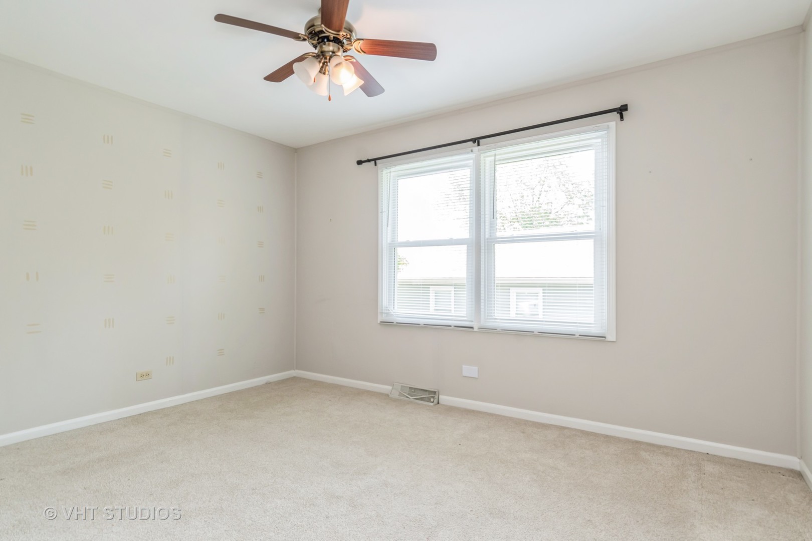 76 West Bailey Road Naperville, IL 60565 - Photo 11 of 20 an empty room with a window and a fan