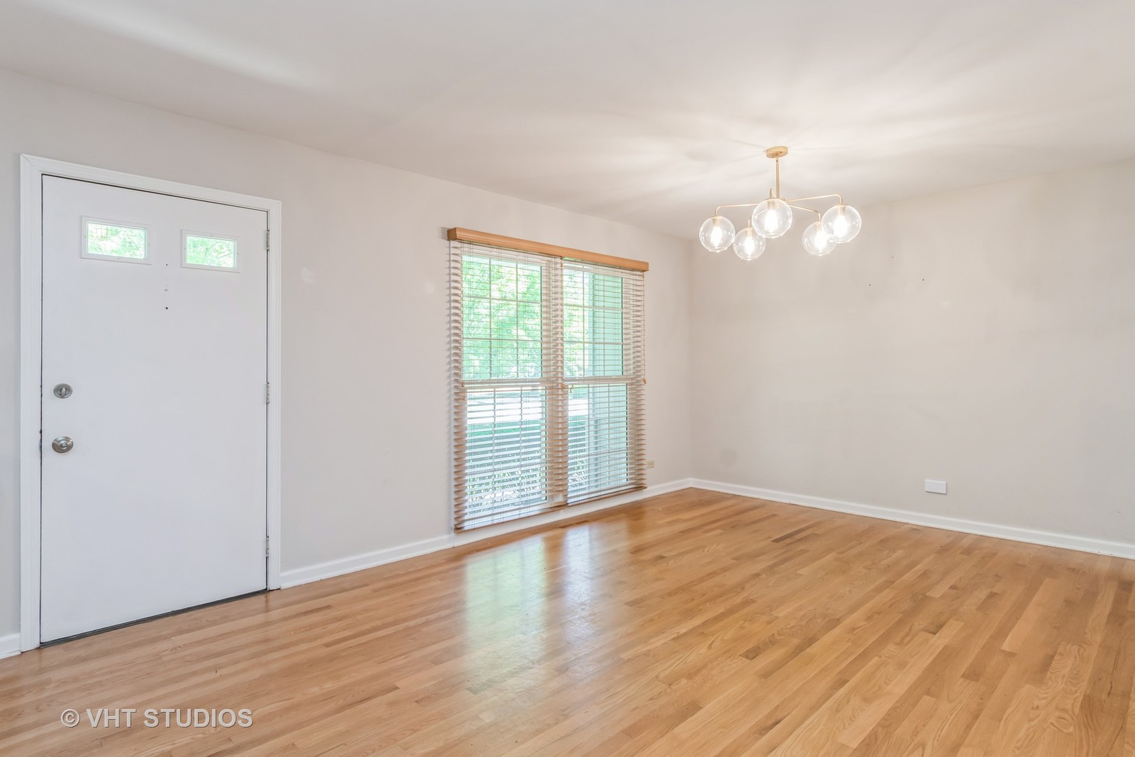 76 West Bailey Road Naperville, IL 60565 - Photo 6 of 20 wooden floor in an empty room with a window