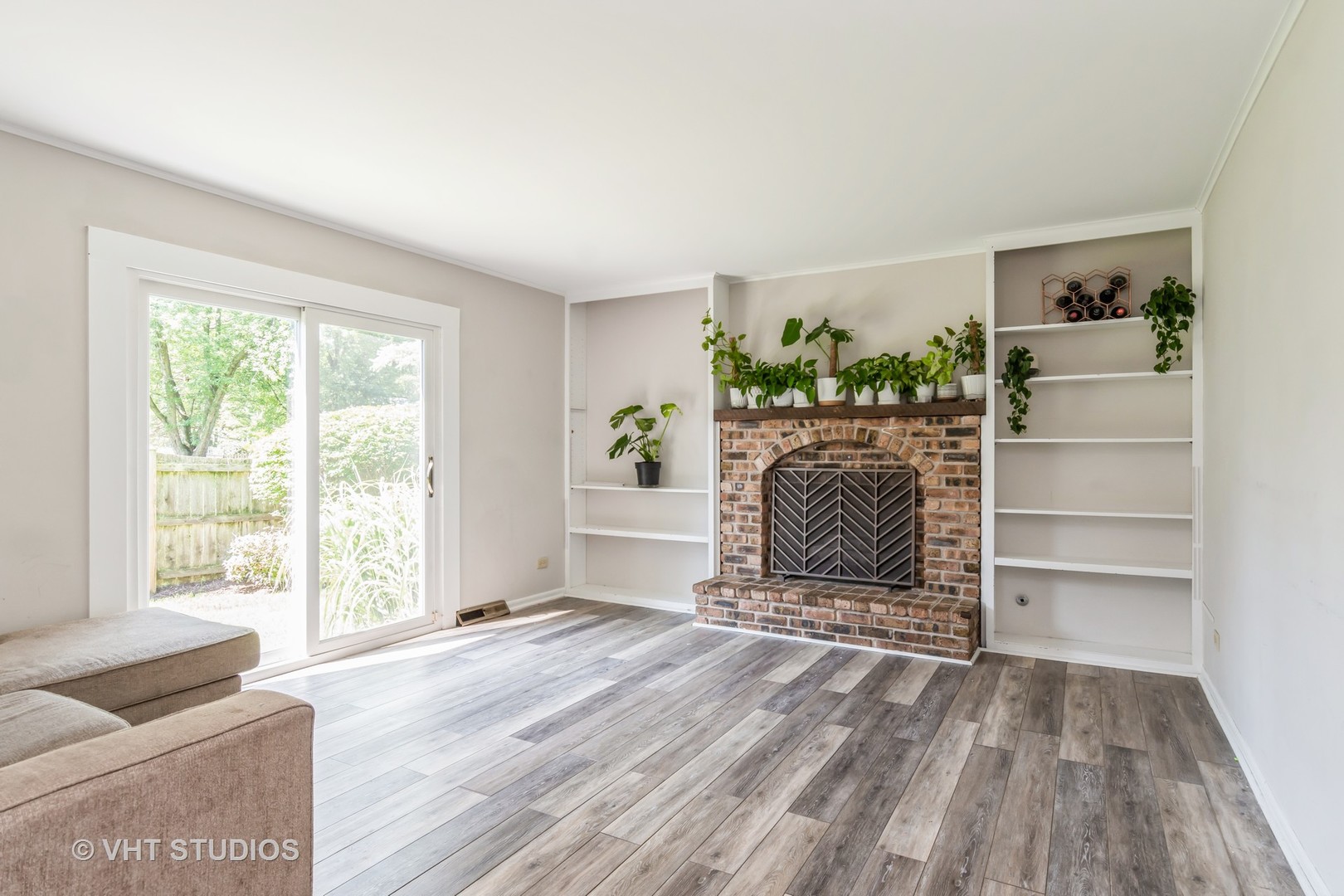 76 West Bailey Road Naperville, IL 60565 - Photo 7 of 20 a living room with a couch and a large window