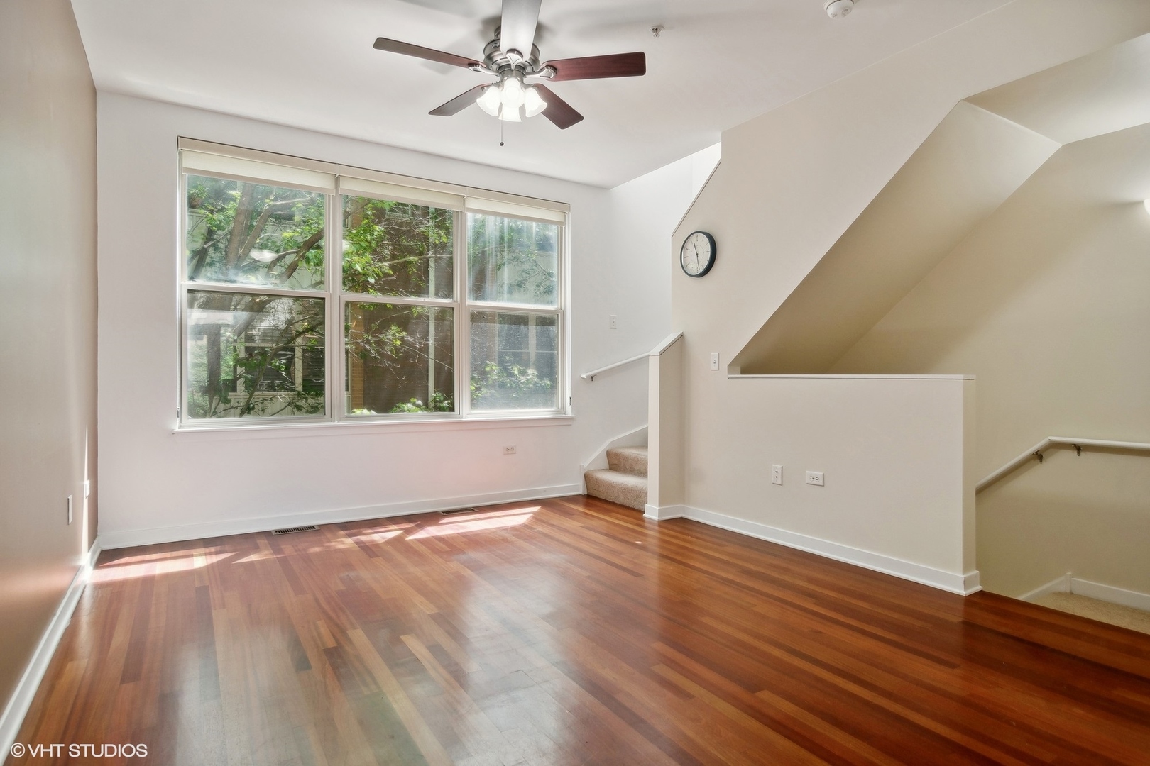 1244 West Monroe Street, Unit 7 Chicago, IL 60607 - Photo 4 of 18 a view of an empty room with wooden floor and a window
