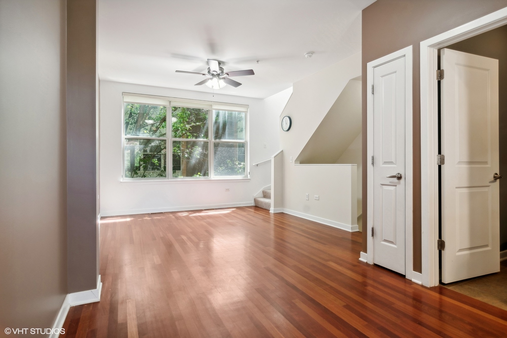 1244 West Monroe Street, Unit 7 Chicago, IL 60607 - Photo 7 of 18 a view of an empty room with wooden floor and a window