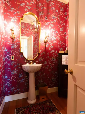 a spacious bathroom with a tub shower and sink