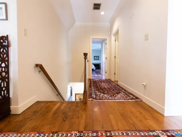 a spacious bedroom with two beds and a fireplace