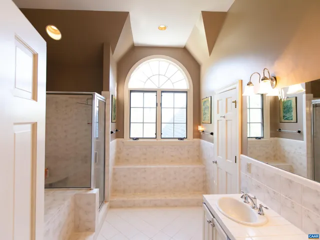 a bedroom with furniture and a flat screen tv