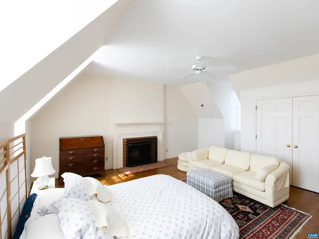 a view of a livingroom with furniture and a fireplace