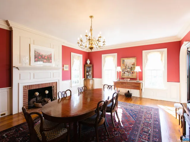 a large kitchen with a table and chairs