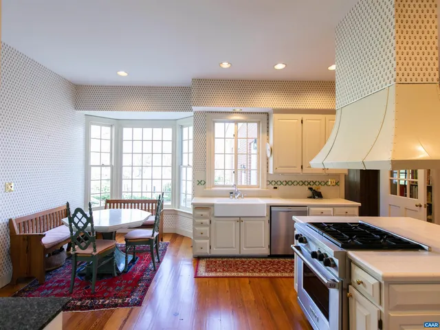 a view of a kitchen area with furniture and fireplace