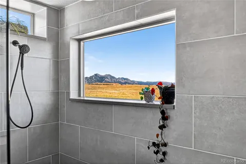 a bathroom with a glass shower door