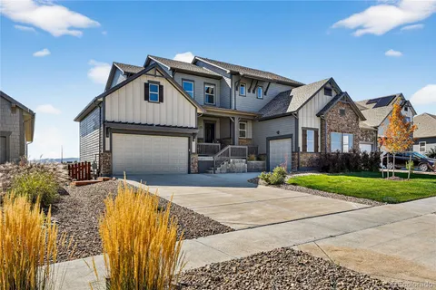 a front view of house with yard outdoor seating and barbeque oven