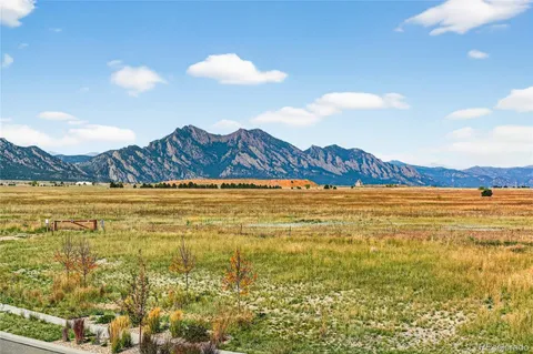 a view of an ocean and a mountain