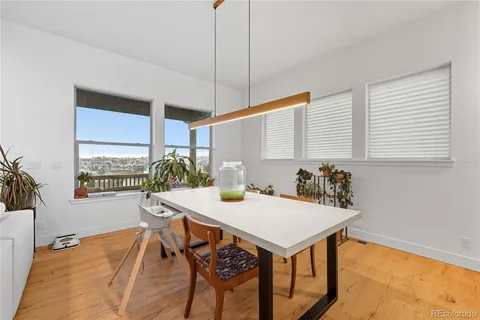 a view of a dining room with furniture and window