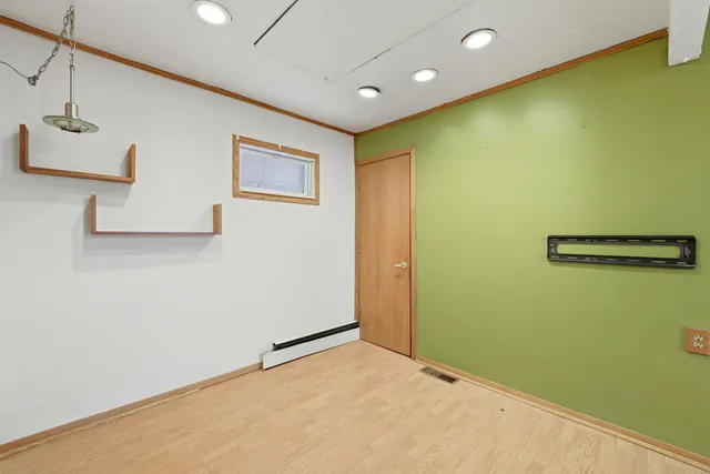 a view of a big room with wooden walls