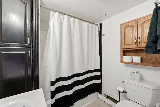 a bathroom with a sink a mirror and a shower