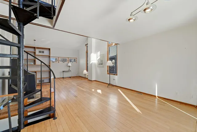 a view of entryway with wooden floor and stairs