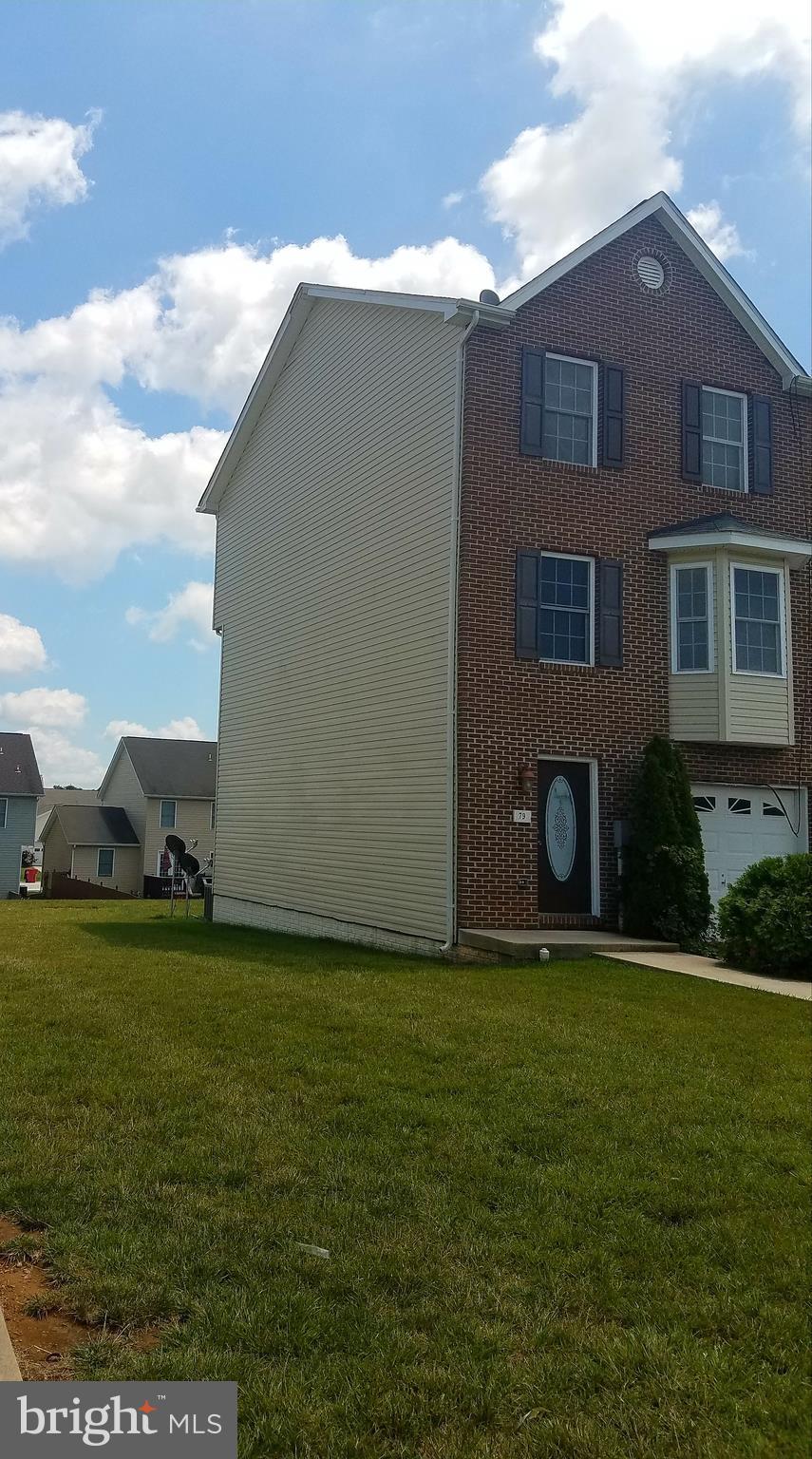 79 Fuzzy Tail Drive Ranson, WV 25438 - Photo 2 of 18 a house view with a garden space