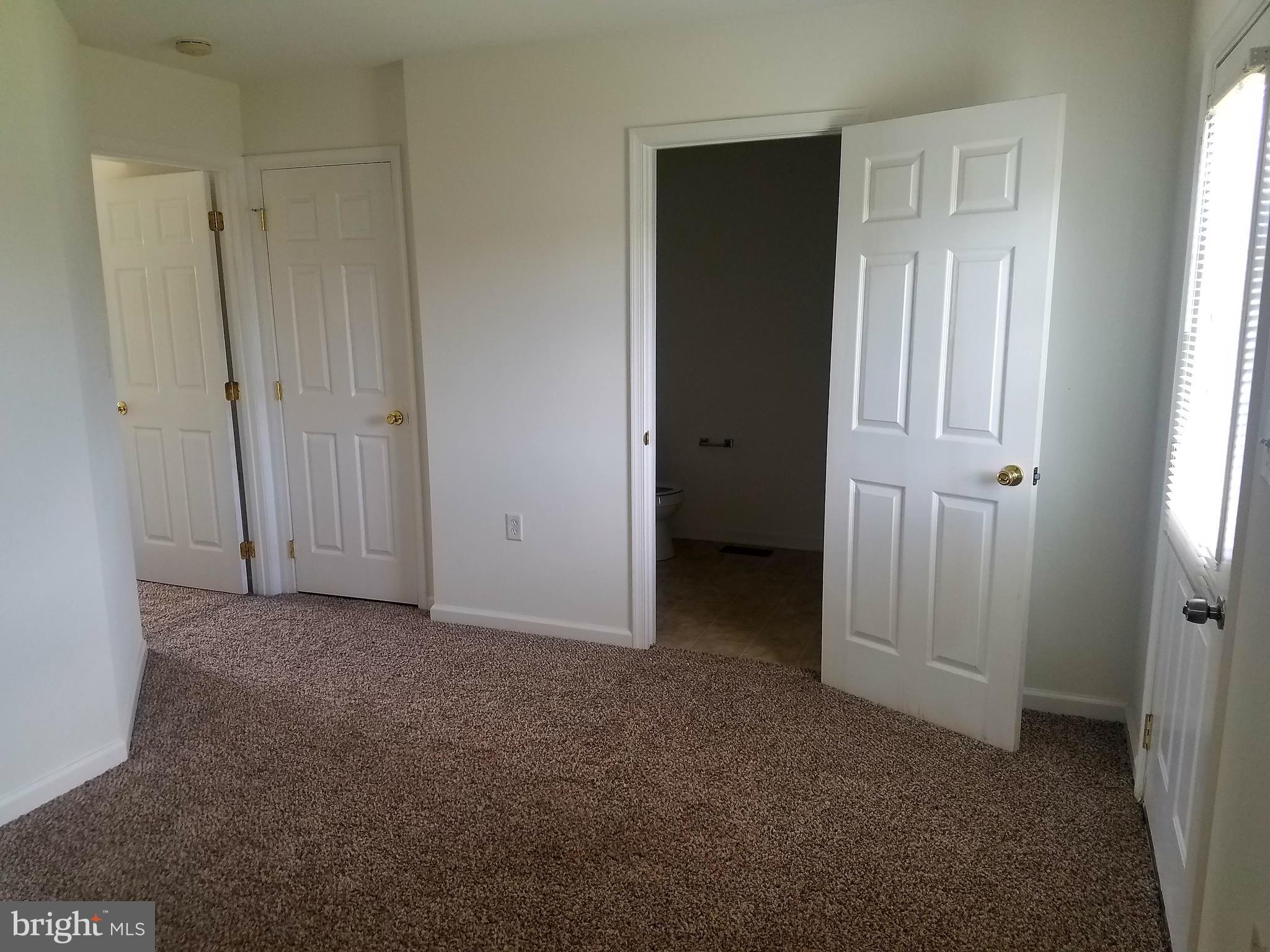 79 Fuzzy Tail Drive Ranson, WV 25438 - Photo 11 of 18 an empty room with windows and closet
