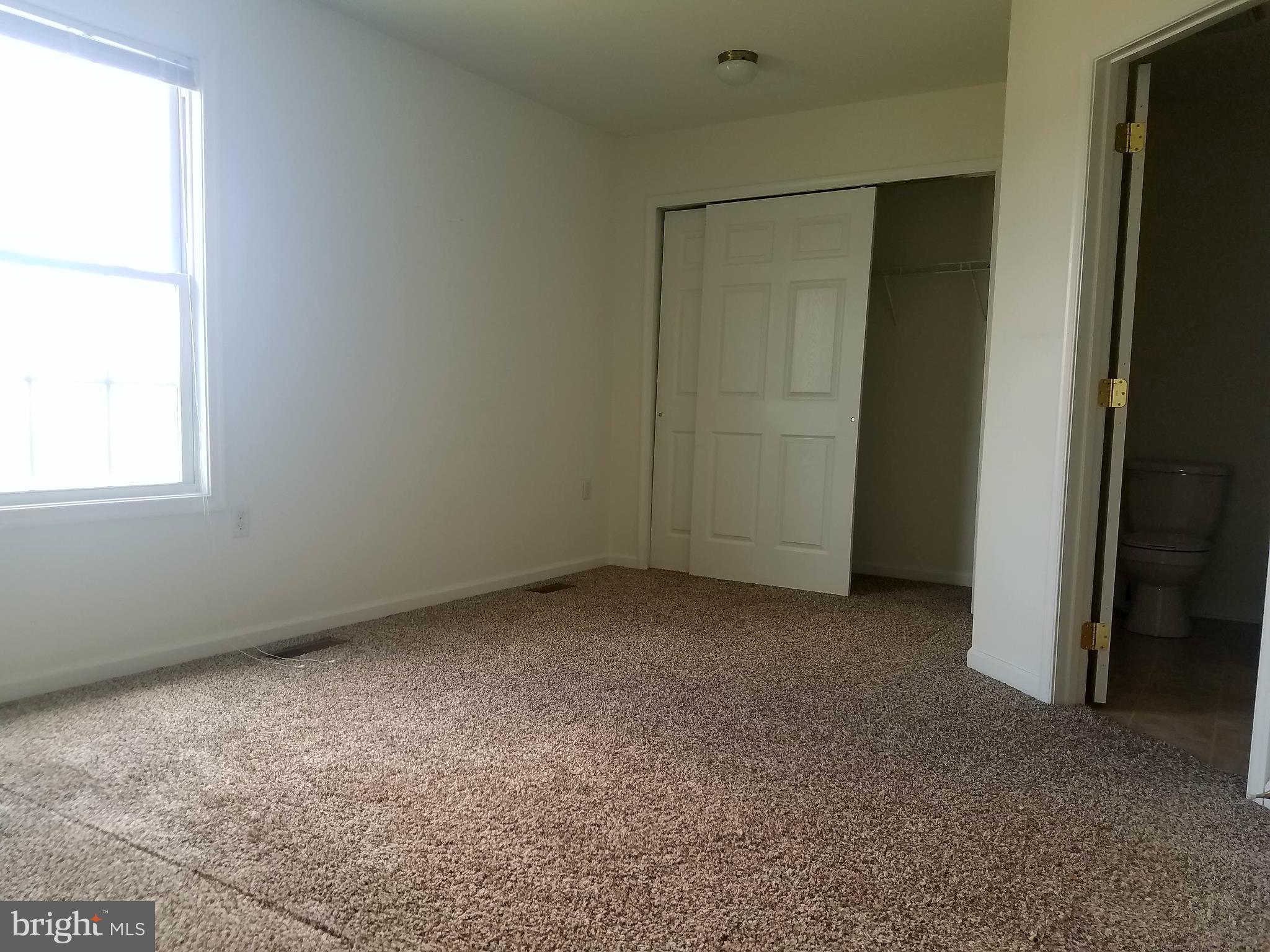 79 Fuzzy Tail Drive Ranson, WV 25438 - Photo 12 of 18 an empty room with windows