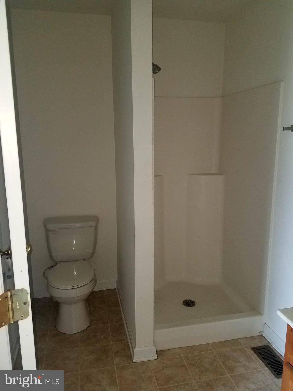 79 Fuzzy Tail Drive Ranson, WV 25438 - Photo 13 of 18 a bathroom with a toilet