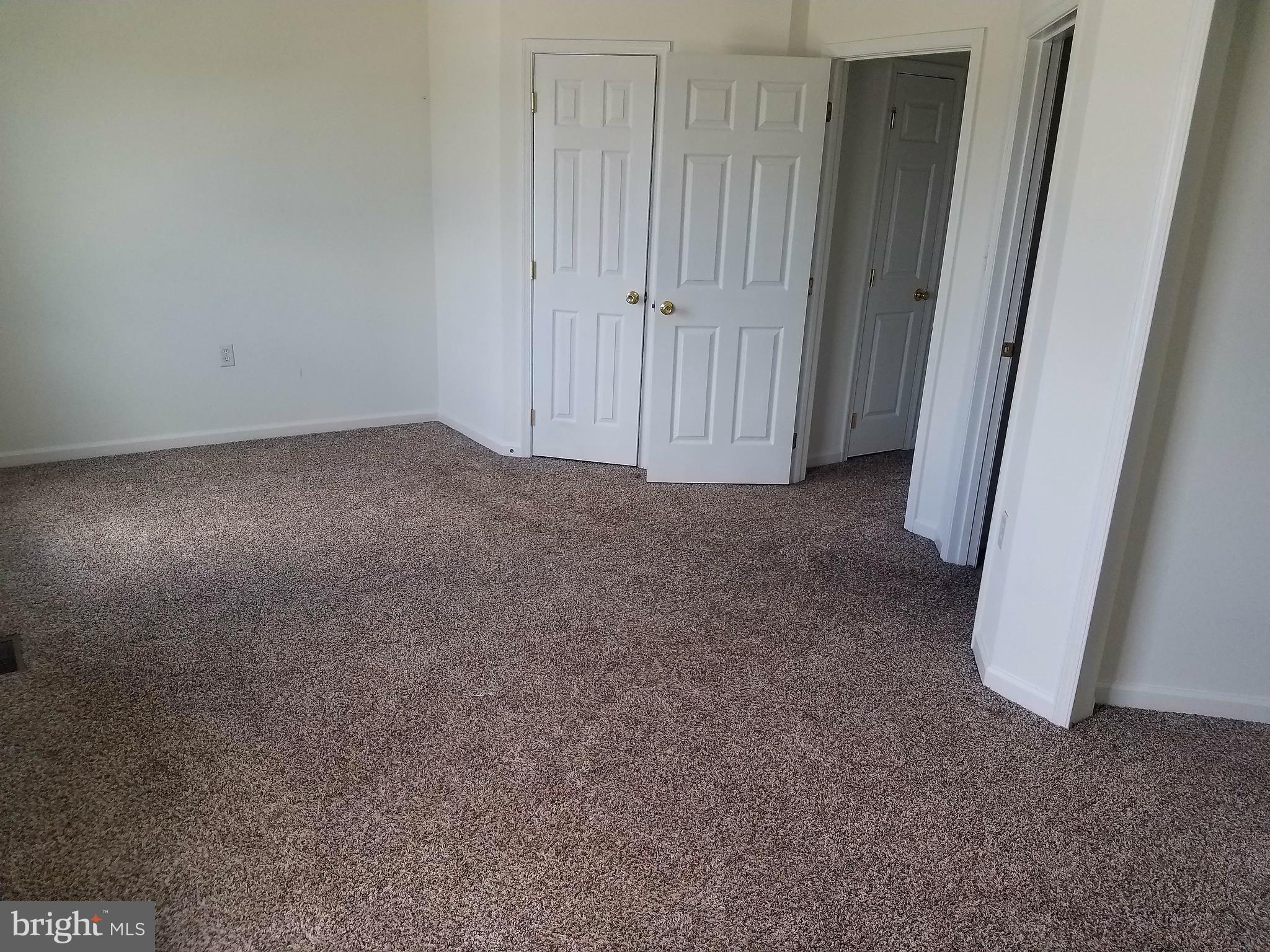 79 Fuzzy Tail Drive Ranson, WV 25438 - Photo 15 of 18 a view of a closet area with white walls