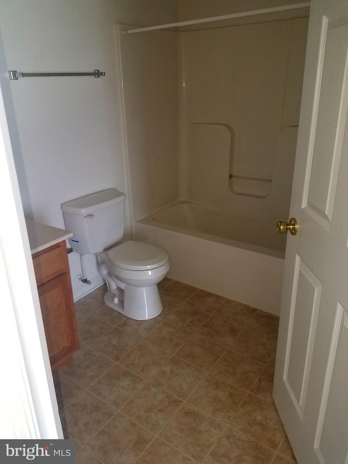 79 Fuzzy Tail Drive Ranson, WV 25438 - Photo 16 of 18 a bathroom with a toilet and a shower