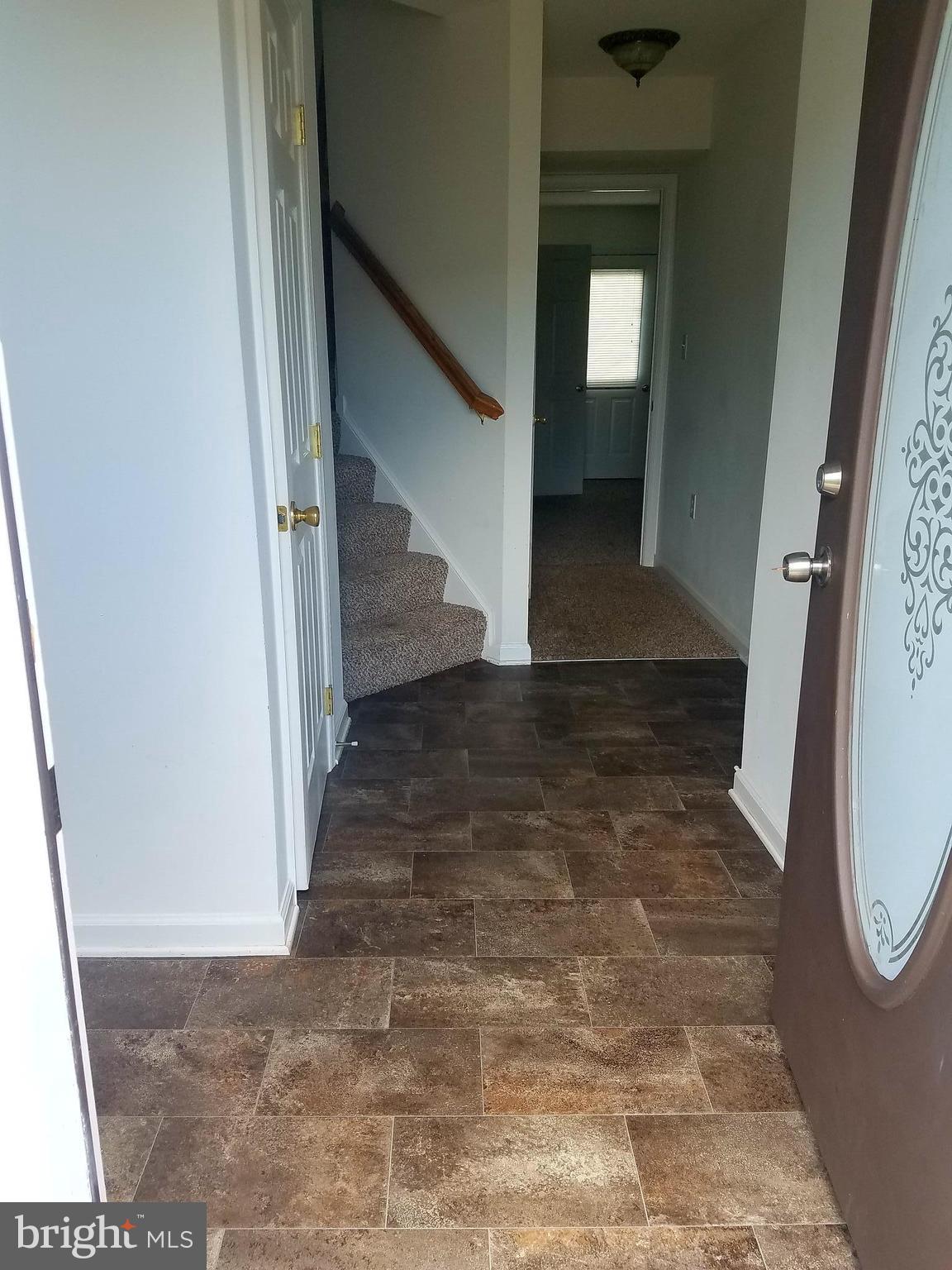 79 Fuzzy Tail Drive Ranson, WV 25438 - Photo 3 of 18 a view of a hallway with staircase