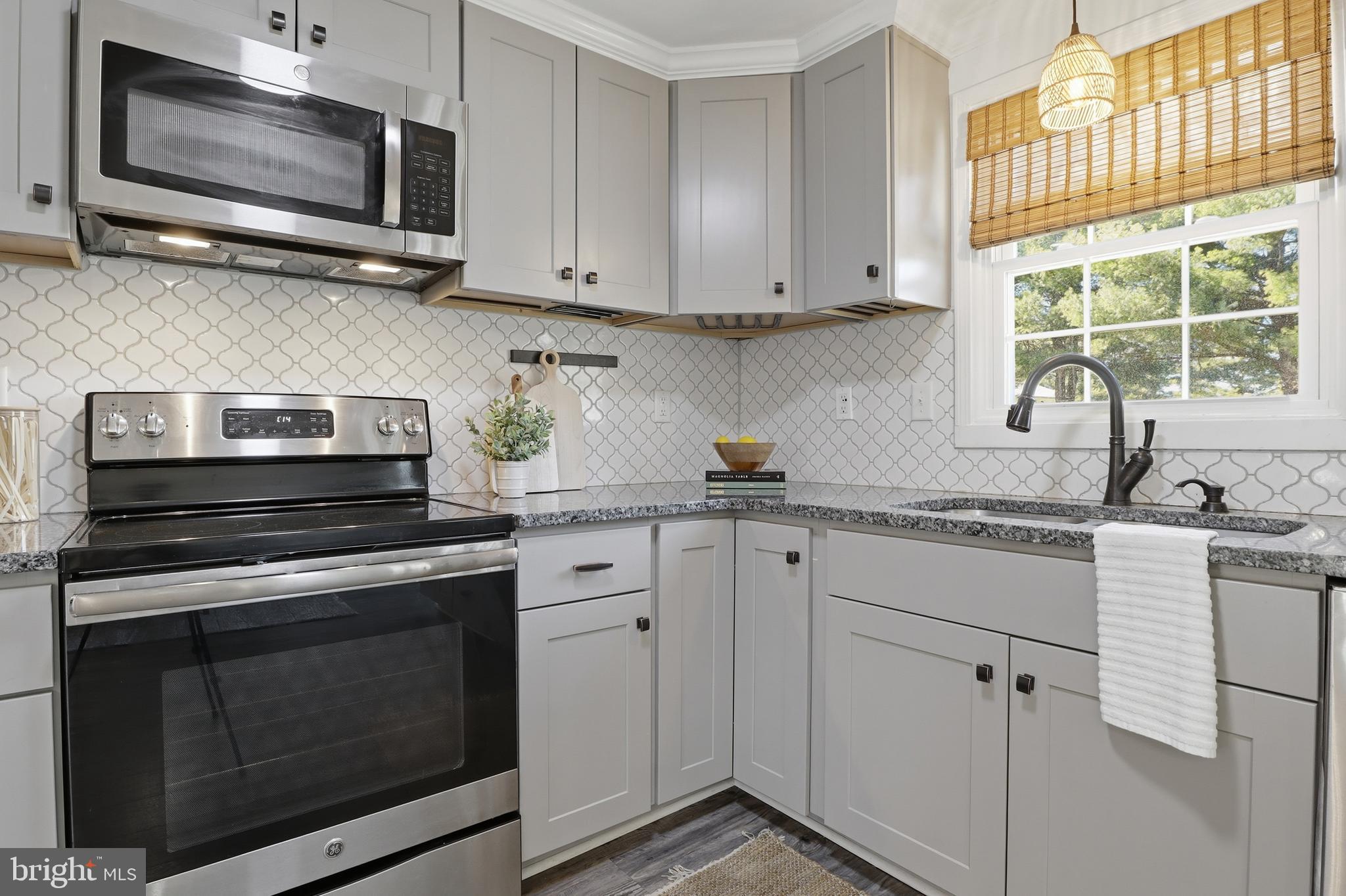 339 Lay Road Delta, PA 17314 - Photo 15 of 60 a kitchen with appliances a sink and a microwave