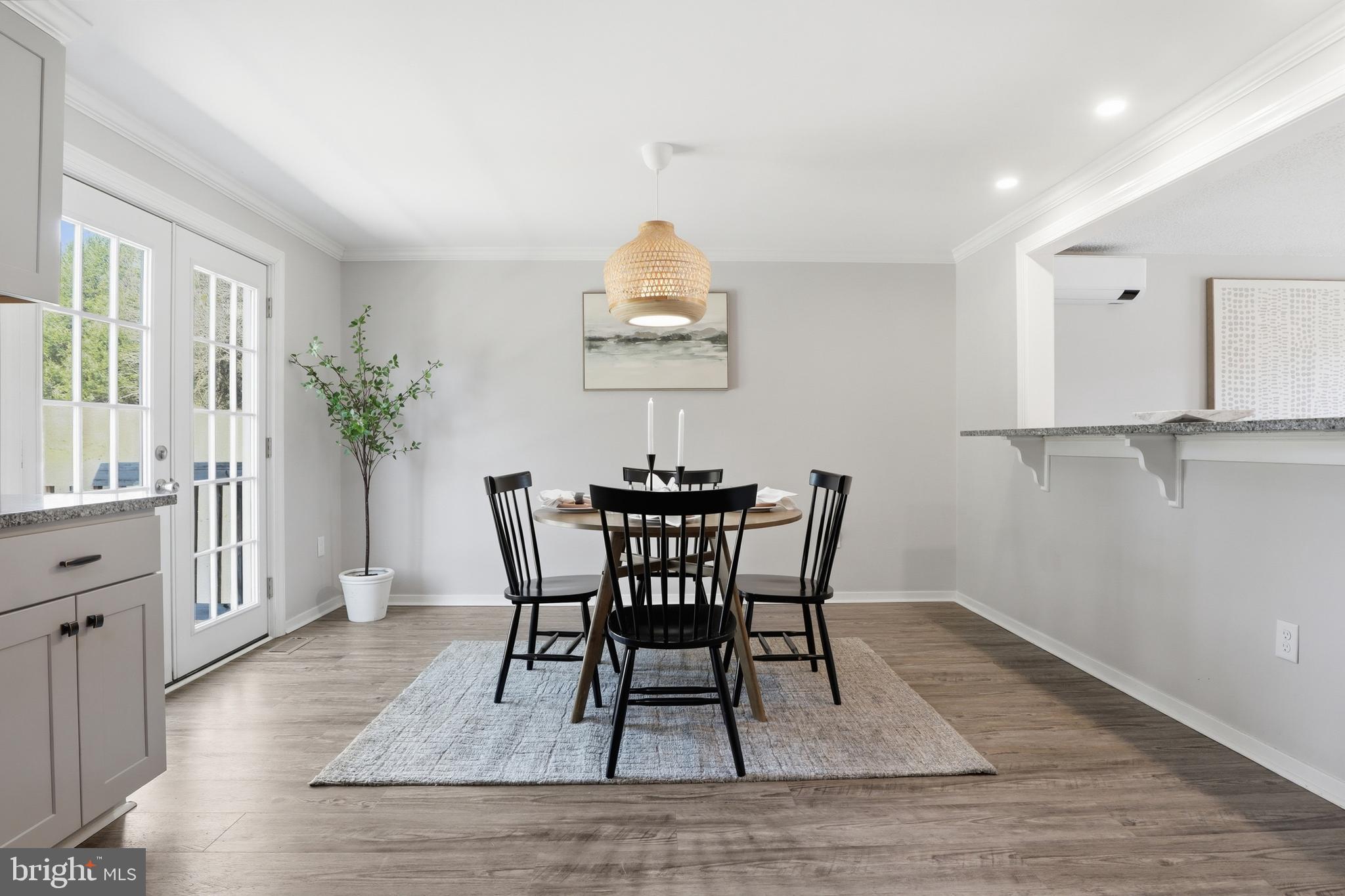 339 Lay Road Delta, PA 17314 - Photo 16 of 60 a dining room with furniture potted plants and wooden floor